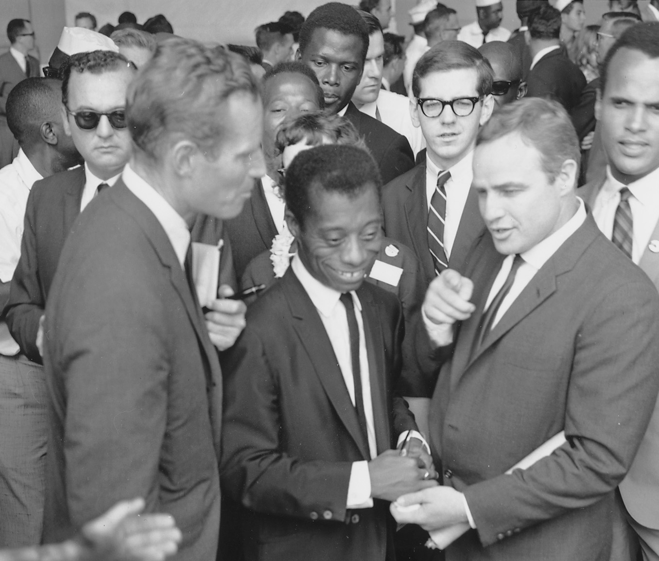 Charlton Heston, James Baldwin and Marlon Brando at the Civil Rights March in Washington DC (National Archives at College Park, Public Domain, via Wikimedia Commons)
