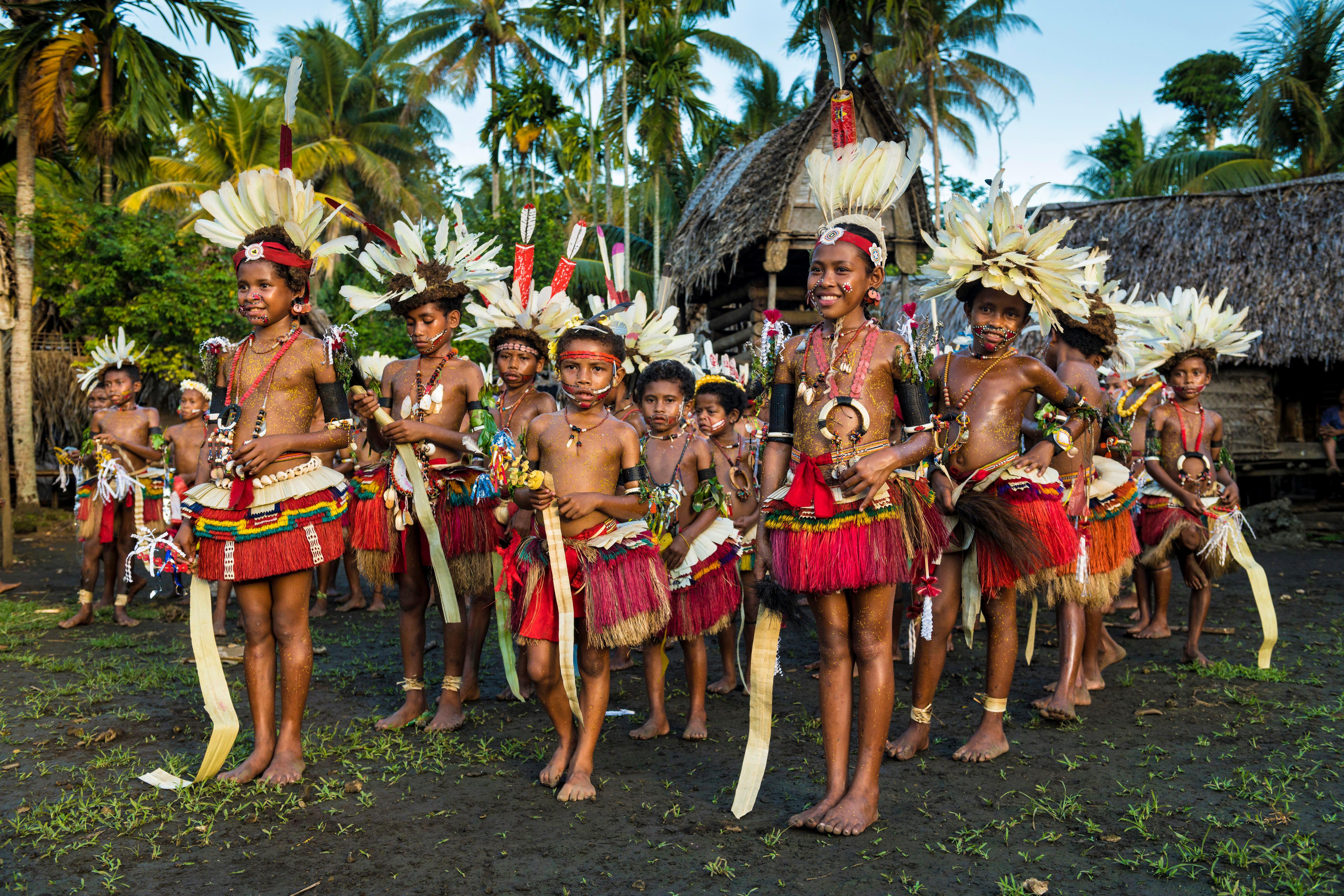 Children performing the Wosi Mwaya dance at the Milamala festival Kiriwina, 2018 (Hemis/Alamy)